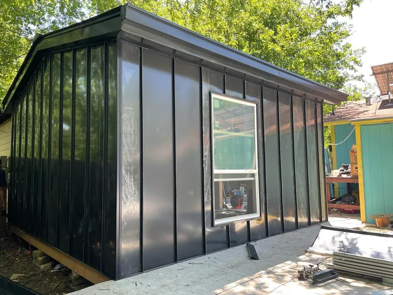 Black standing seam metal wall panels for Roof Inspection in Richmond Heights